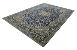 Corner detail of 2000s Kashan rug showing border pattern and Wool pile