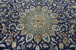 Central medallion detail of 2000s Kashan rug from Iran / Persia