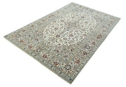 Corner detail of 2000s Kashan rug showing border pattern and Wool pile