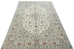 Surface texture of 2000s Kashan rug with natural Wool and intricate pattern