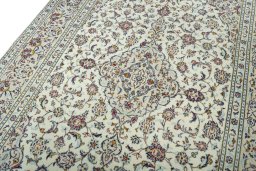 Backside of handmade 2000s Kashan rug showing knot structure and weave density