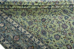 Close-up detail of 2000s Kashan rug from Iran / Persia showing Wool weave