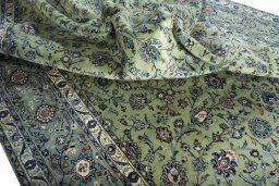 Surface texture of 2000s Kashan rug with natural Wool and intricate pattern