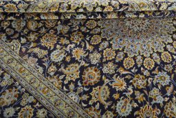 Close-up detail of 2000s Kashan rug from Iran / Persia showing Wool weave