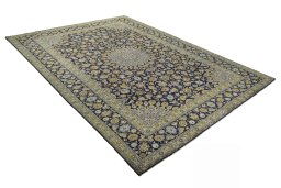 Close-up detail of 2000s Kashan rug from Iran / Persia showing Wool weave