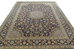 Surface texture of 2000s Kashan rug with natural Wool and intricate pattern