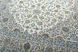 Close-up detail of 2000s Kashan rug from Iran / Persia showing Wool weave