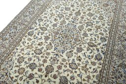 Backside of handmade 2000s Kashan rug showing knot structure and weave density