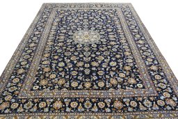 Surface texture of 2000s Kashan rug with natural Wool and intricate pattern