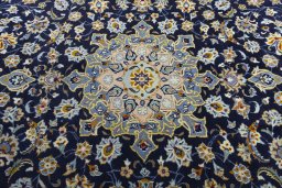 Central medallion detail of 2000s Kashan rug from Iran / Persia