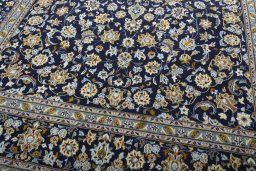 Close-up detail of 2000s Kashan rug from Iran / Persia showing Wool weave