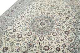 Backside of handmade 2000s Kashan rug showing knot structure and weave density