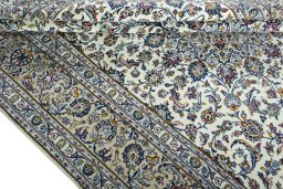 Close-up detail of 2000s Kashan rug from Iran / Persia showing Wool weave