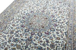 Backside of handmade 2000s Kashan rug showing knot structure and weave density