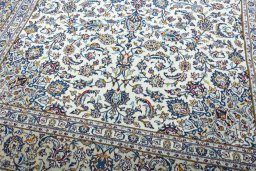 Close-up detail of 2000s Kashan rug from Iran / Persia showing Wool weave