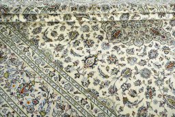 Close-up detail of 2000s Kashan rug from Iran / Persia showing Wool weave