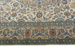 Corner detail of 2000s Kashan rug showing border pattern and Wool pile