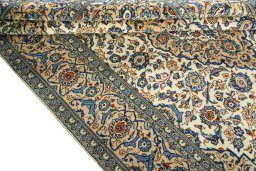 Close-up detail of 2000s Kashan rug from Iran / Persia showing Wool weave