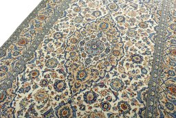 Backside of handmade 2000s Kashan rug showing knot structure and weave density