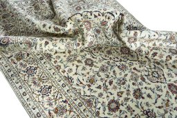 Surface texture of 2000s Kashan rug with natural Wool and intricate pattern