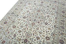 Backside of handmade 2000s Kashan rug showing knot structure and weave density