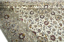 Close-up detail of 2000s Kashan rug from Iran / Persia showing Wool weave