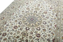 Backside of handmade 2000s Kashan rug showing knot structure and weave density
