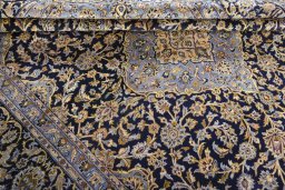 Close-up detail of 2000s Kashan rug from Iran / Persia showing Wool weave