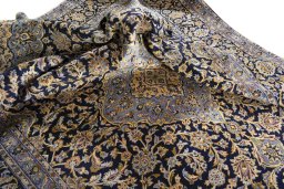 Surface texture of 2000s Kashan rug with natural Wool and intricate pattern