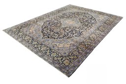 Corner detail of 2000s Kashan rug showing border pattern and Wool pile