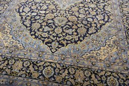 Close-up detail of 2000s Kashan rug from Iran / Persia showing Wool weave