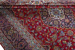 Close-up detail of 2000s Kashan rug from Iran / Persia showing Wool weave