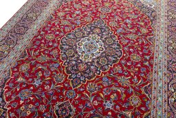 Backside of handmade 2000s Kashan rug showing knot structure and weave density