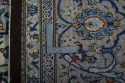 Backside of handmade 1970s Kashan rug showing knot structure and weave density