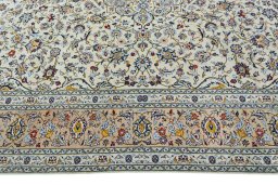 Corner detail of 2000s Kashan rug showing border pattern and Wool pile