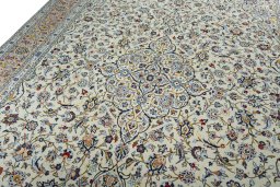 Backside of handmade 2000s Kashan rug showing knot structure and weave density