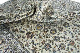 Surface texture of 2000s Kashan rug with natural Wool and intricate pattern