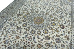 Backside of handmade 2000s Kashan rug showing knot structure and weave density
