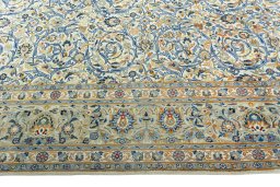 Corner detail of 2000s Kashan rug showing border pattern and Wool pile