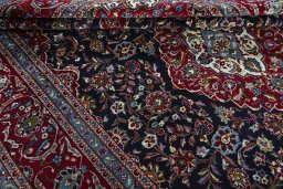 Close-up detail of 2000s Kashan rug from Iran / Persia showing Wool weave