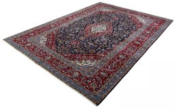 Corner detail of 2000s Kashan rug showing border pattern and Wool pile
