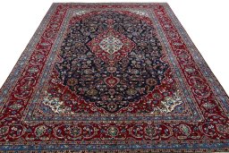 Surface texture of 2000s Kashan rug with natural Wool and intricate pattern