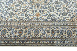Corner detail of 2000s Kashan rug showing border pattern and Wool pile