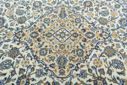 Central medallion detail of 2000s Kashan rug from Iran / Persia