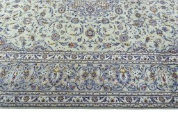 Corner detail of 2000s Kashan rug showing border pattern and Wool pile
