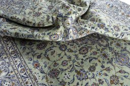 Surface texture of 2000s Kashan rug with natural Wool and intricate pattern