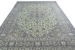 Surface texture of 2000s Kashan rug with natural Wool and intricate pattern