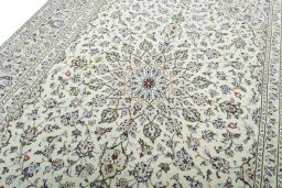 Backside of handmade 2000s Kashan rug showing knot structure and weave density