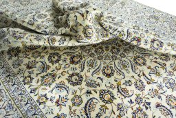 Surface texture of 1970s Kashan rug with natural Wool and intricate pattern