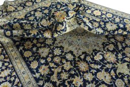 Surface texture of 2000s Kashan rug with natural Wool and intricate pattern